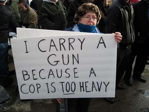 Sign says: "I carry a gun because a cop is too heavy"